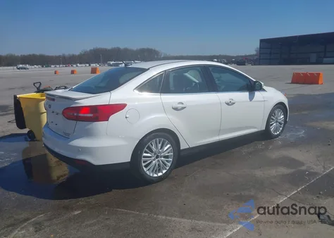 2016 Ford Focus Titanium z USA, uszkodzony, nr VIN 1FADP3J27GL359200